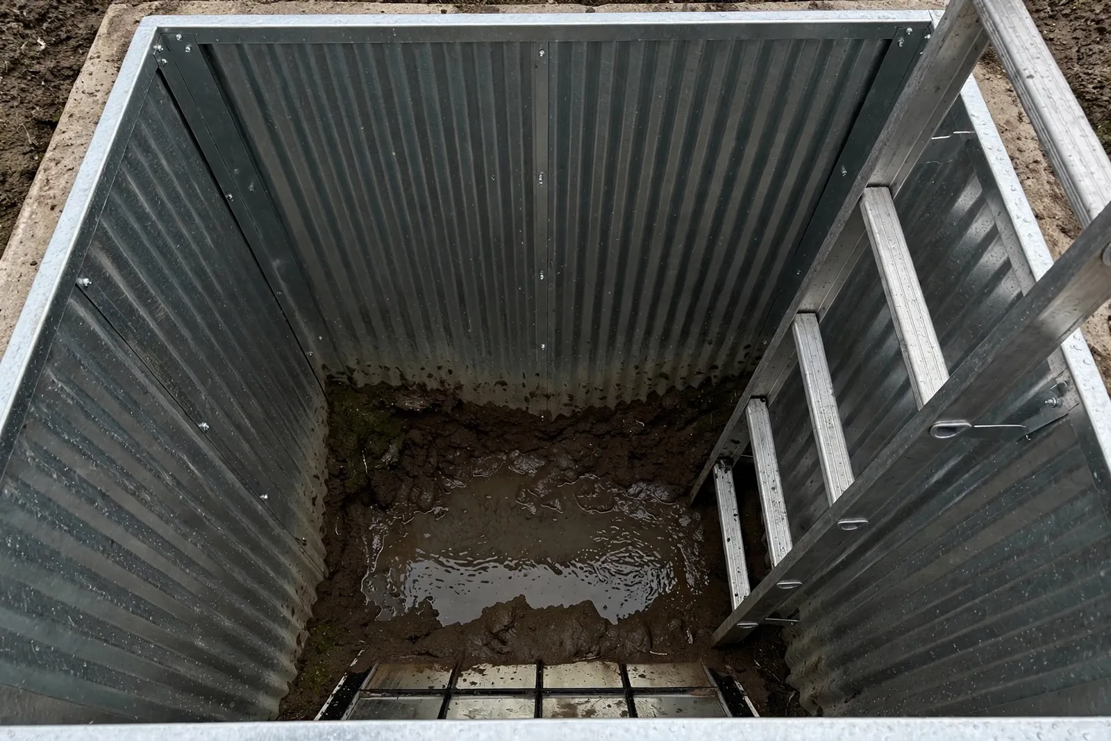 Before photo, Egress Window Well Drainage Correction in St. Charles, by Waldorf Egress Window Company
